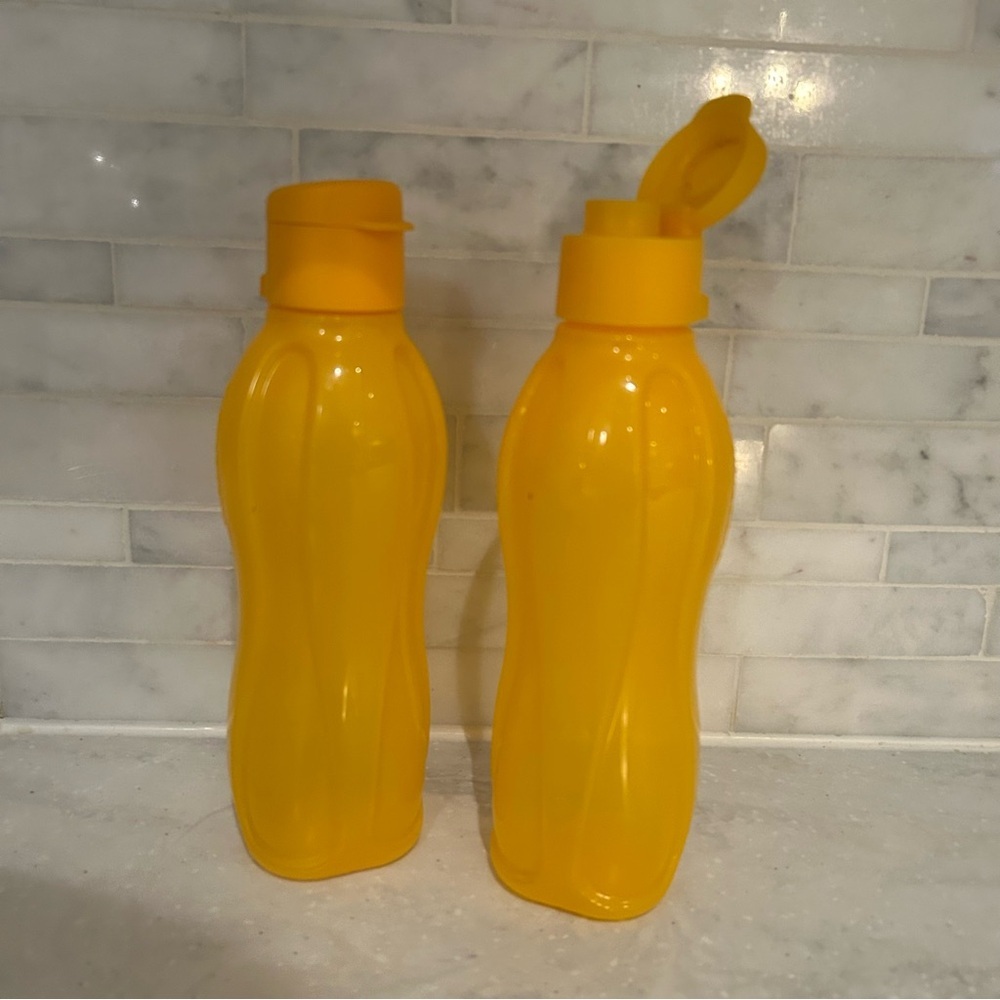 Tupperware Set of Two Yellow / orange Water Bottles with flip top lids. EUC!